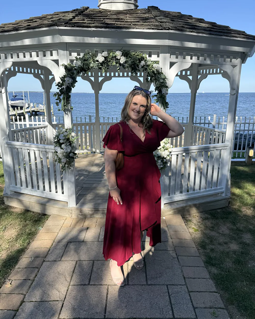 Wedding guest in ZZV Atelier Burgundy crepe wrap maxi dress at a fall wedding
