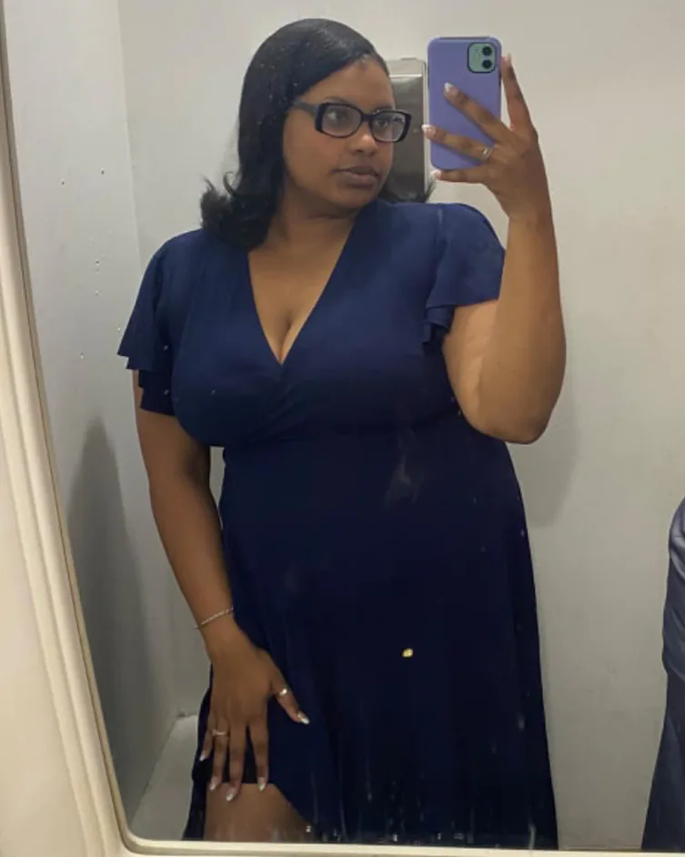Woman in ZZV Atelier Midnight Navy wrap maxi dress at formal event