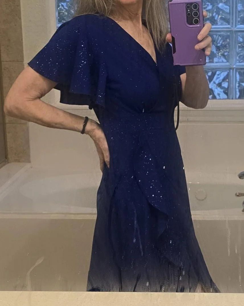 Woman in ZZV Atelier Sapphire Starlight glitter wrap maxi dress